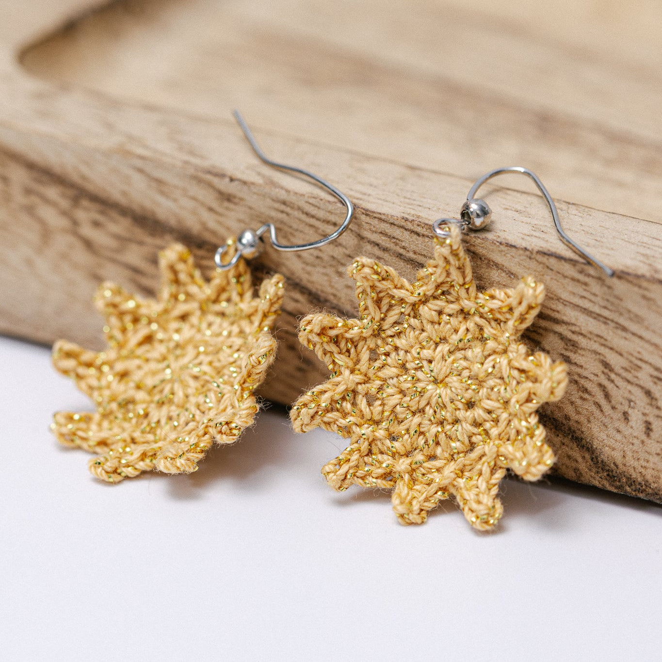 Detail of sun earrings